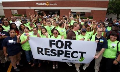 Members of OUR Walmart march to the superstore's headquarters in 2011 to present their unified demands