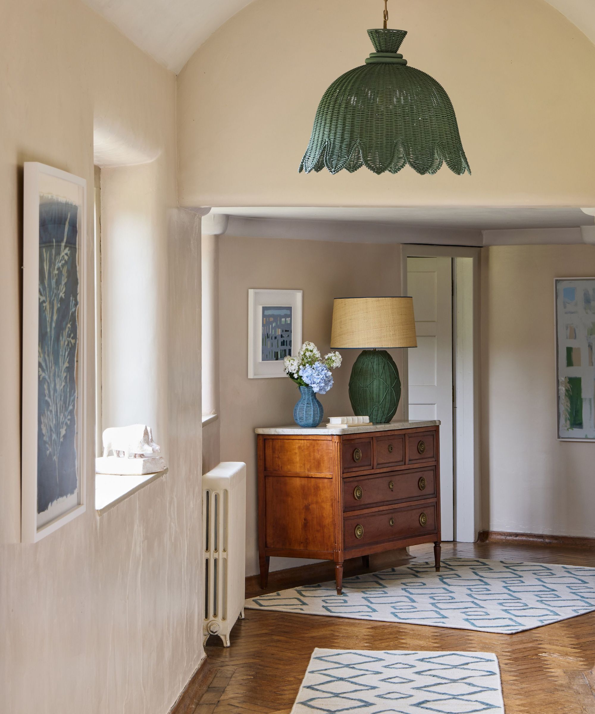 Hallway with a green bell flower shaped ceiling light