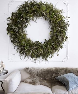 living room with oversized wreath