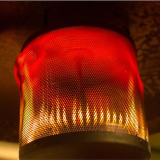 Closeup of gas patio heater with flames