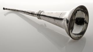 A silver ear trumpet from 1814 London, England.