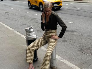 Christie Tyler wearing striped trousers.