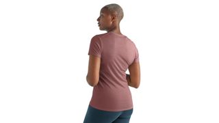 View from the back of a woman wearing the Women's Cool-Lite Amplify Short Sleeve Low Crewe T-Shirt