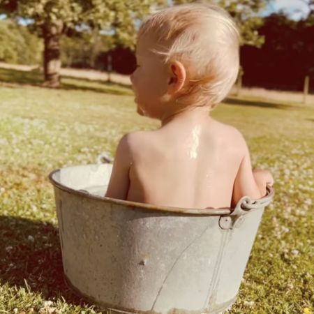James Middleton's son, Inigo, bathing in a bucket outside