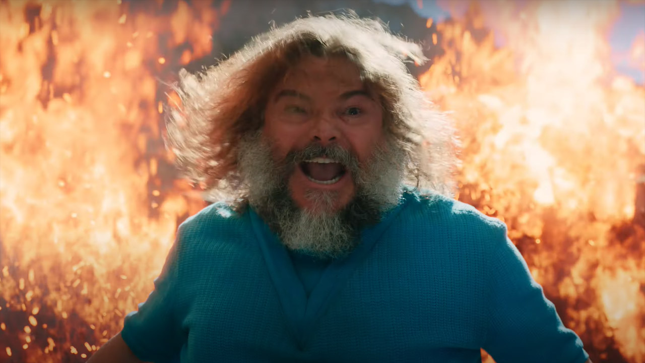 Jack Black's Steve stands in front of some flames in A Minecraft Movie