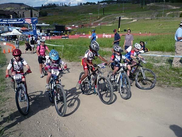 Junior women 10 and under start off up a big hill.
