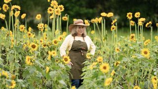 Patricia Arquette standing in a sunflower field in Murdaugh: Death in the Family