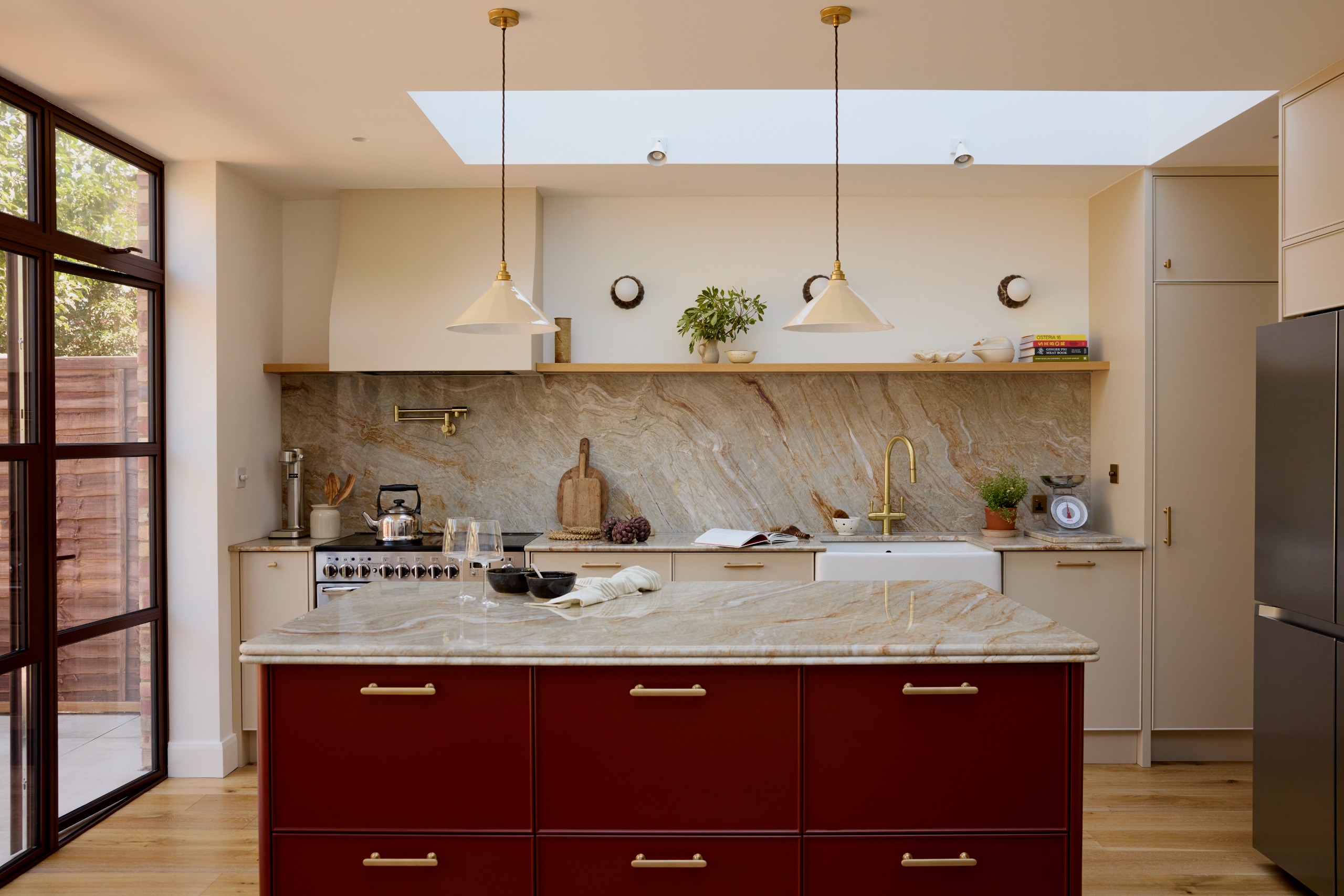 Modern kitchen with red island, Nacorado worktops and critall doors