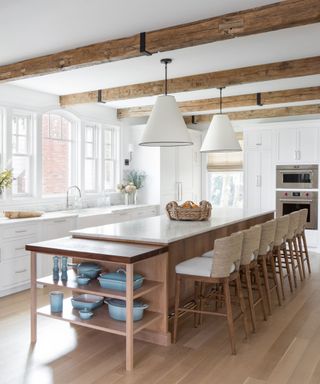 An organic modern kitchen with rafter ceilings and open shelving