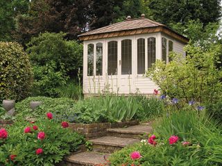 summer house ideas: white summer house at top of steps from Malvern Garden Buildings