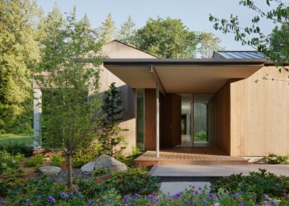 Interurban Residence, a low timber home with minimalist style and light wood tones