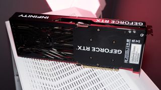 A Palit RTX 5060 Ti Infinity 3 with three fans and 16 GB of memory on a computer.