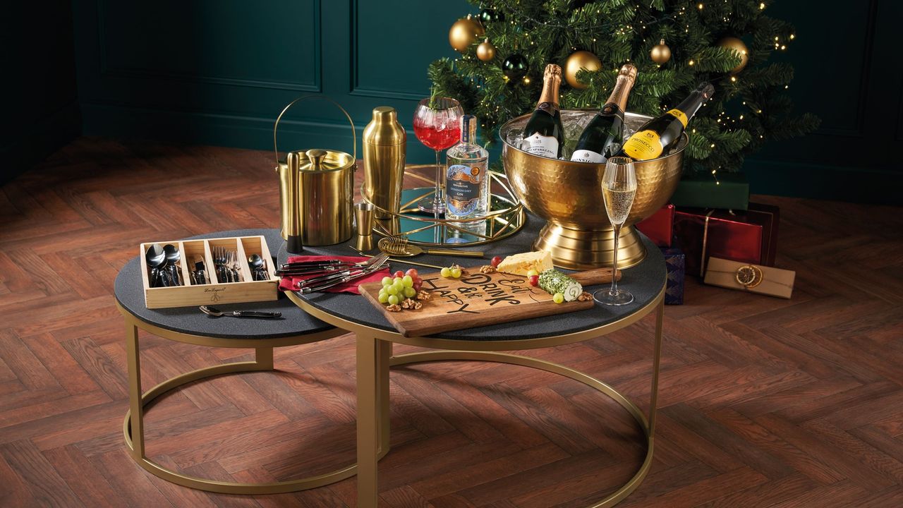 assortment of cocktail champagne bowl, ice bucket, shaker set, and glasses on table