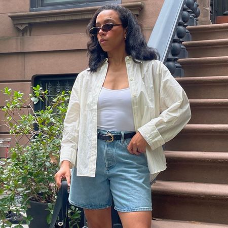 Lauren Tappan wearing a yellow button-down and denim bermuda shorts