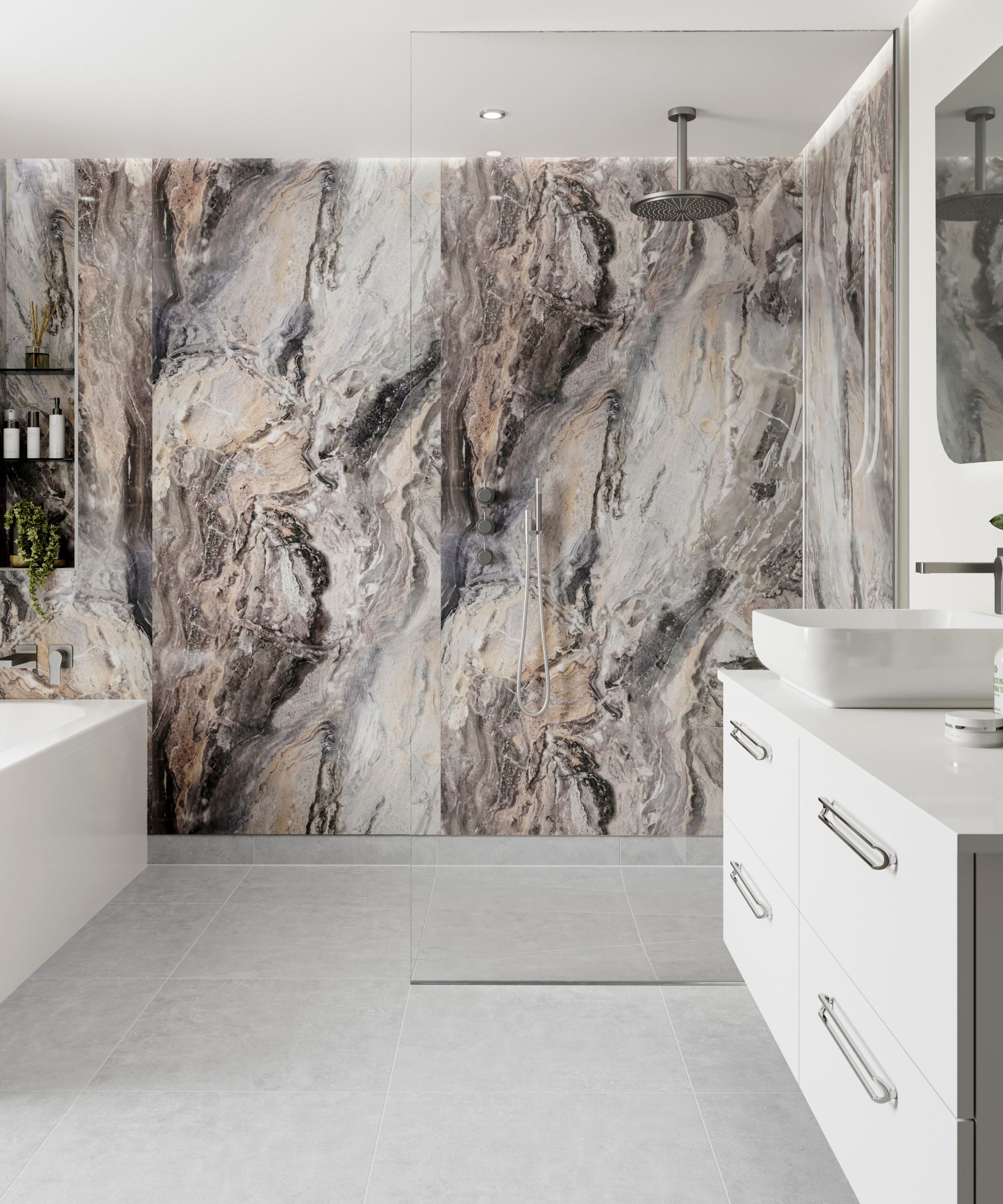 A large walk in shower in a bright contemporary bathroom with a large white vanity and wet wall panels in an ornate marble effect