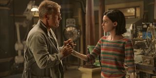 Alita: Battle Angel Dr. Ido holds Alita's hand in the lab