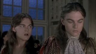 Leonardo DiCaprio as Philippe Bourbon looking disdainfully at his twin brother, Leonardo DiCaprio as King Louis XIV in The Man in the Iron Mask