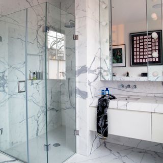 white tiled bathroom with shower area