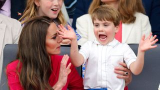 Kate Middleton trying to calm a waving Prince Louis