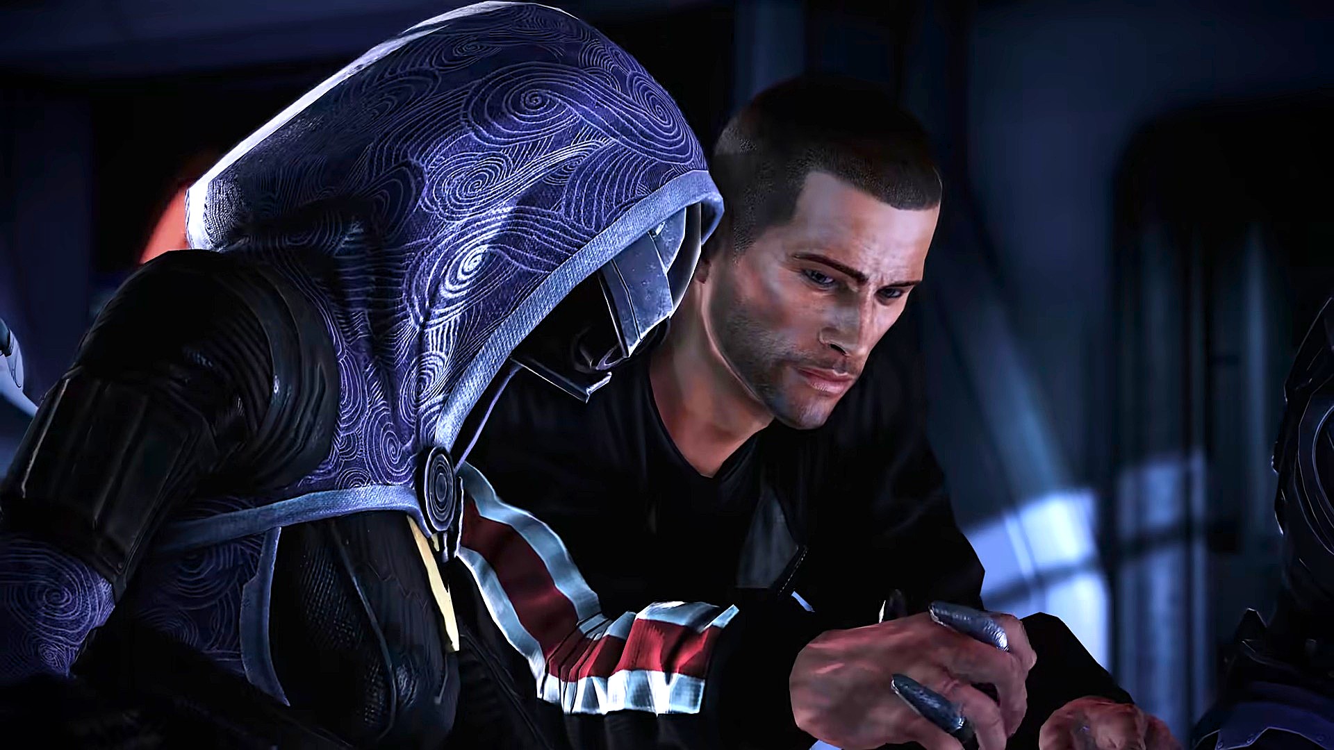 A hooded, masked figure in a patterned blue cloak faces a worried man in black, who cradles a small object in a dim, tense room.