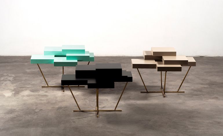 &#039;Pixel&#039; tables, by Russian designer Ilia Potemine, presented by Gallery S Bensimon at Design Days Dubai. Three block stepped shaped tables in different colours.