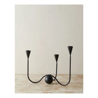 black metal candle holder with three arms