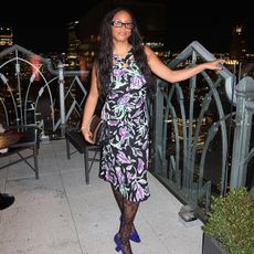 woman wearing floral dress and glasses