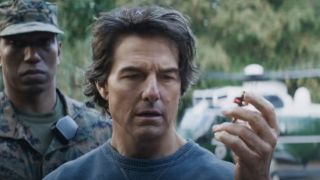 Tom Cruise looks at a key with worry in Mission: Impossible - The Final Reckoning.