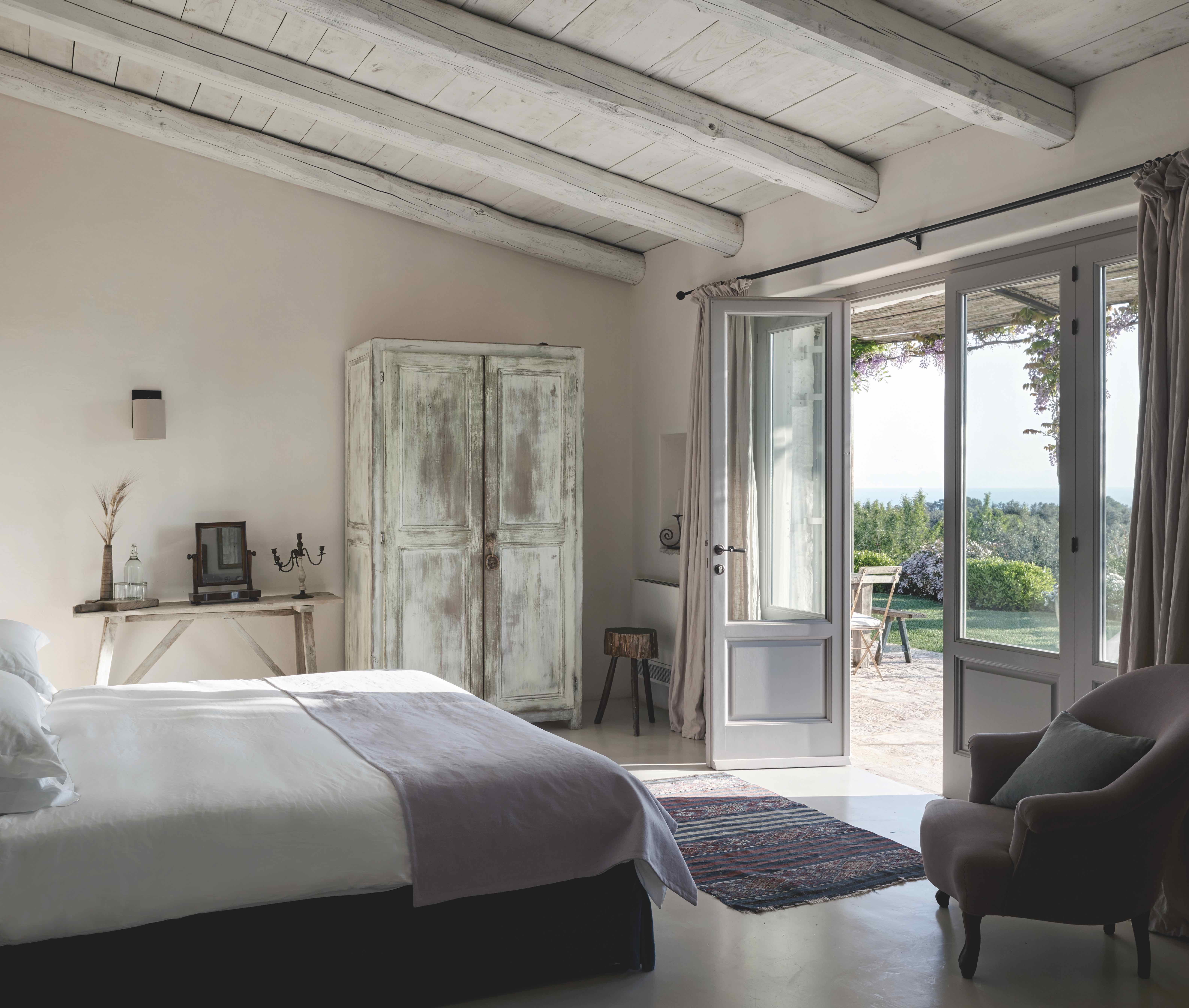 farmhouse bedroom with bed and wardrobe