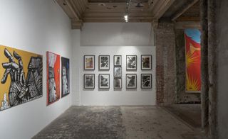 Displayed alongside the canvas works are a collection of monotypes that depict abstracted versions of the sculptural heads