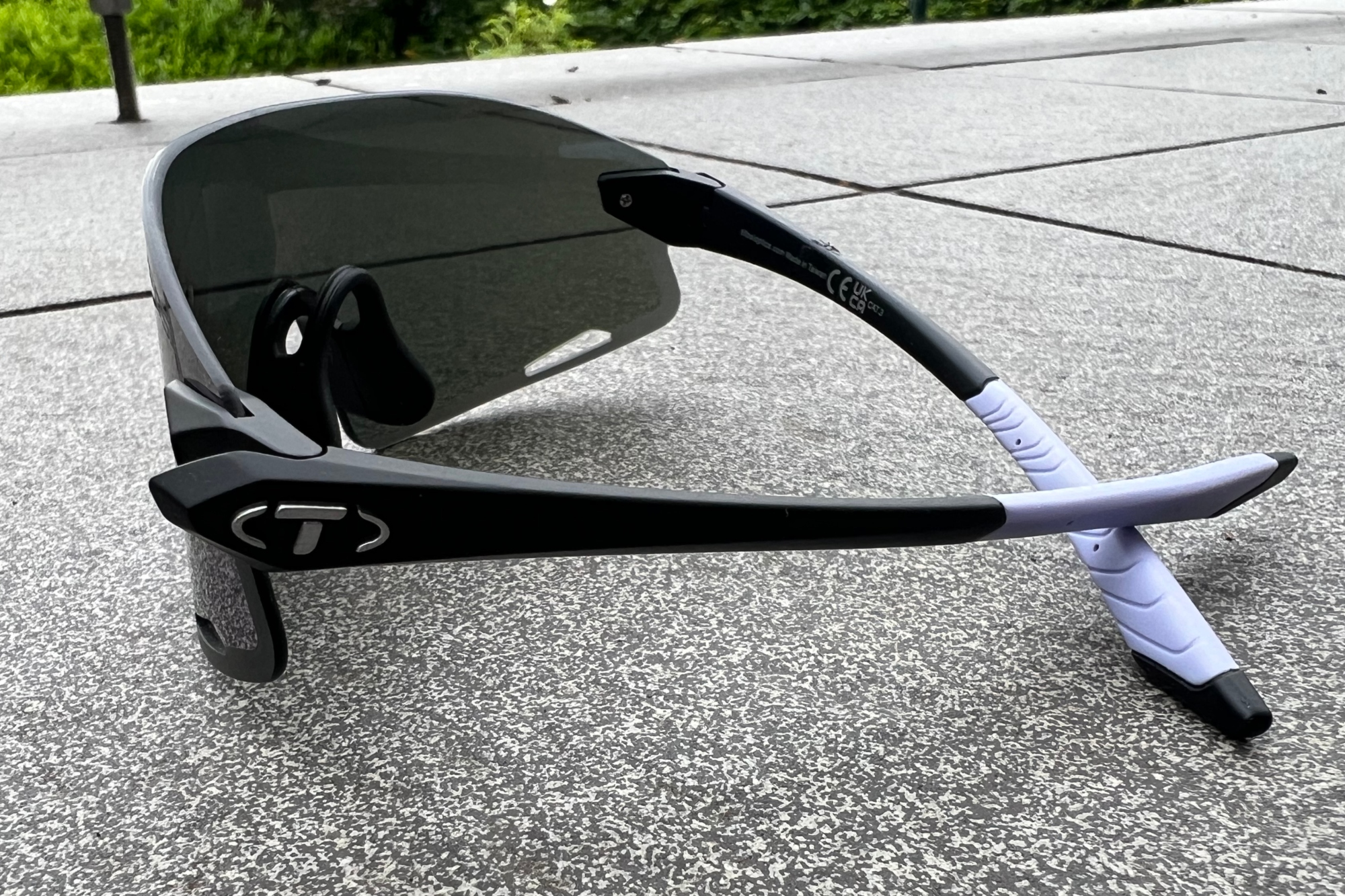 The Tifosi Vogel XC Sunglasses seen side on on a grey tile
