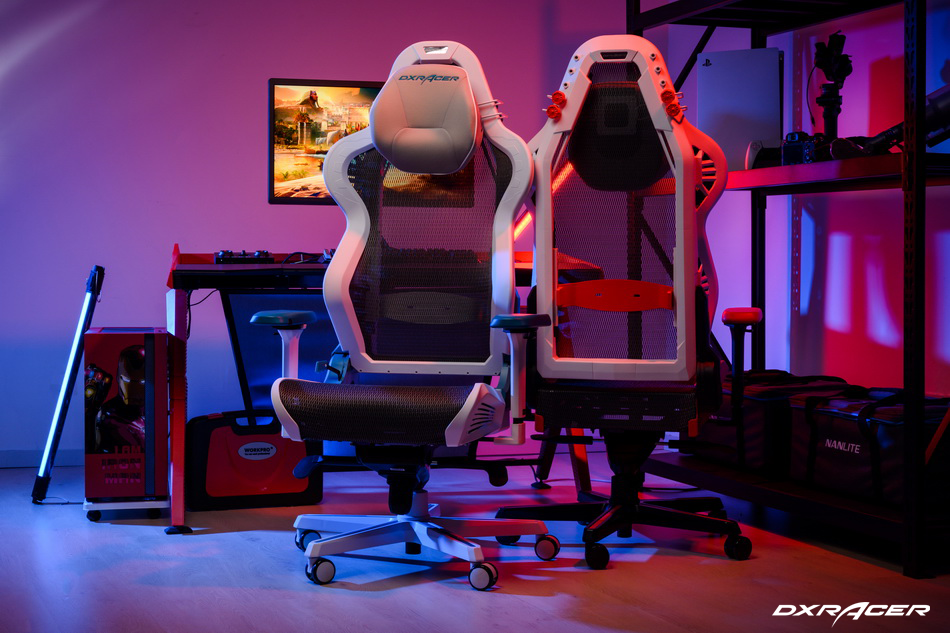A product shot of the Air Series chair. One chair is facing forward, and the other is facing back to the camera. Both show off the mesh bodies of the Air Series with white support frames and headrests.