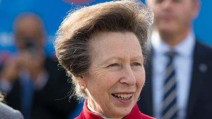 Princess Anne's cranberry red dress wows. Seen here is Princess Anne in Cardiff Bay