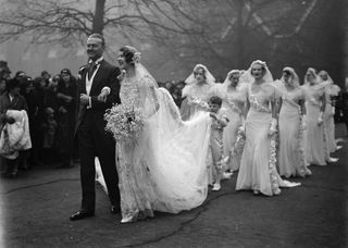 1930s wedding in black and white with eight bridesmaids