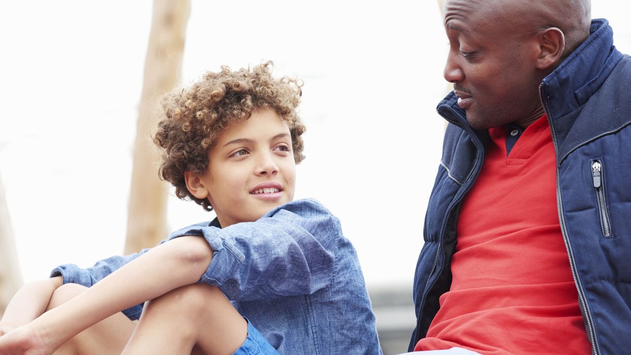 Dad in conversation with son