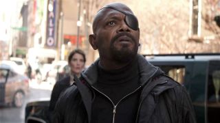 Nick Fury looks shocked as he stares into the sky in Avengers: Infinity War