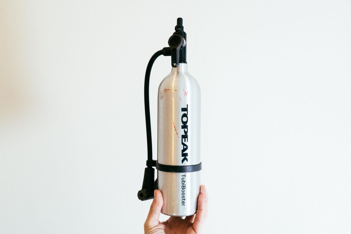 A silver compressed air canister