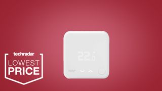 The Tado smart thermostat V3 on a red background with a white lowest price badge to the left of it
