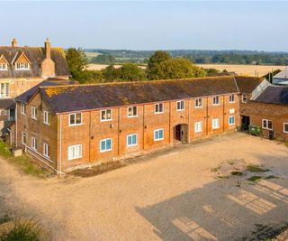 Red brick farm buildings on a plot