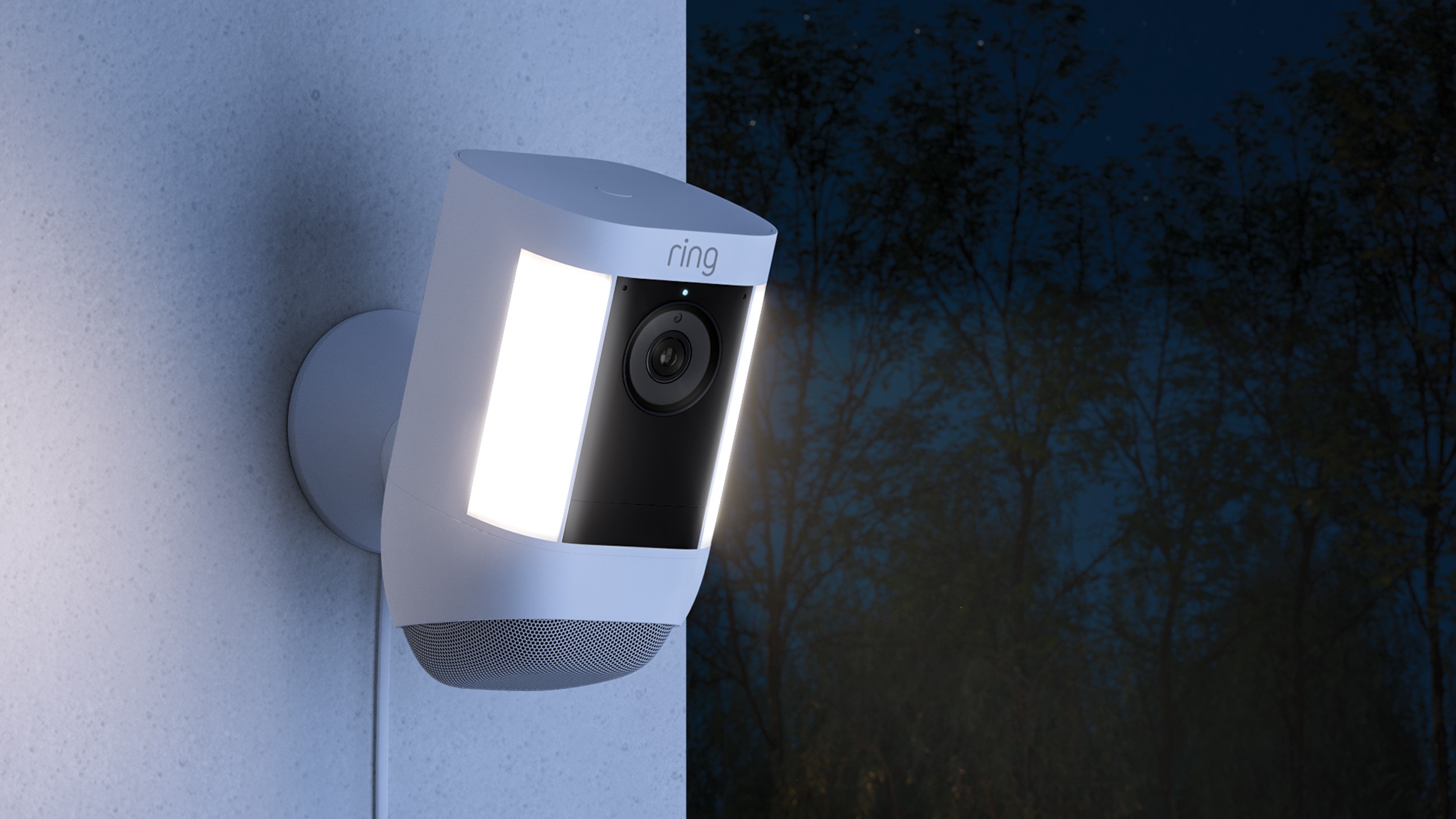 Spotlight Cam Pro at night with its powerful light and speaker.