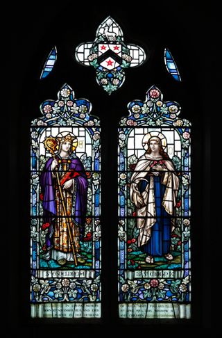 A stained glass window by William Morris & Co depicting Saints Etheldreda and Urith, St Mary's Church, South Walsham, Norfolk. Sherwood coat of arms