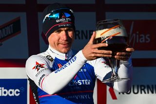 Dutch Fabio Jakobsen of QuickStep Alpha Vinyl celebrates on the podium with a large glass of beer after winning the KuurneBrusselsKuurne one day cycling race 1951 km from Kuurne to Kuurne via Brussels Sunday 27 February 2022 BELGA PHOTO JASPER JACOBS Photo by JASPER JACOBSBELGA MAGAFP via Getty Images
