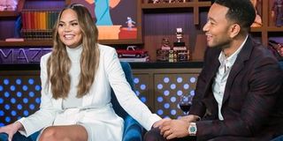 Chrissy Teigen and John Legend on a chat show.