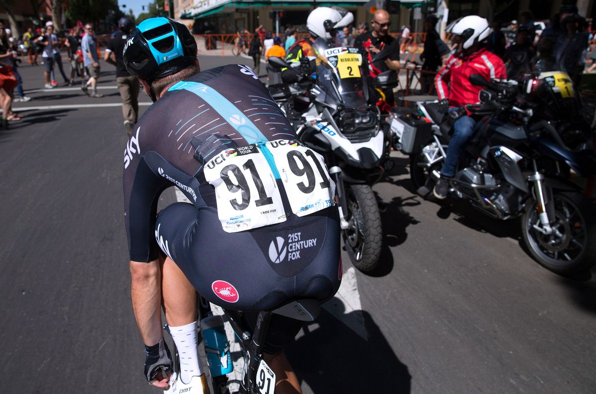 Elia Viviani adjusts his shoe after placing third