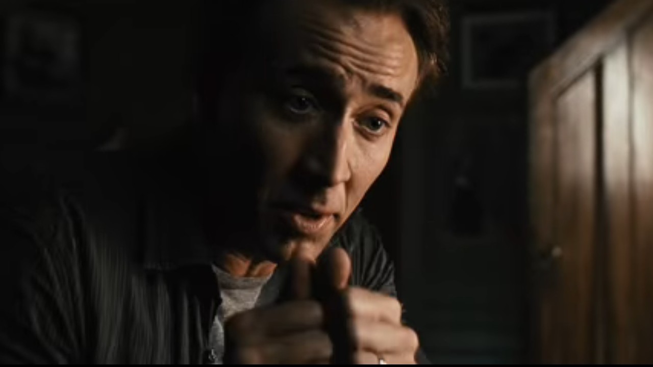 Nicolas Cage putting his fists together in Knowing