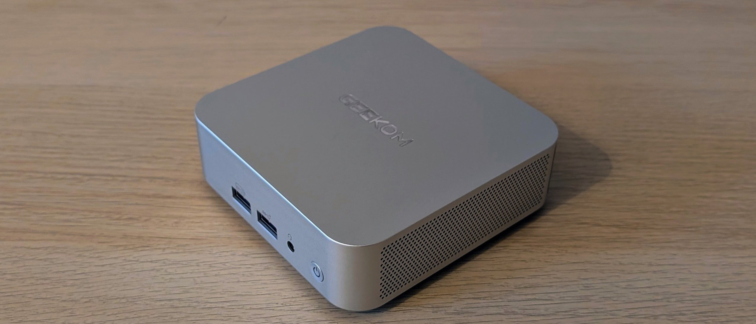 The Geekom A8 AI mini PC on a desk