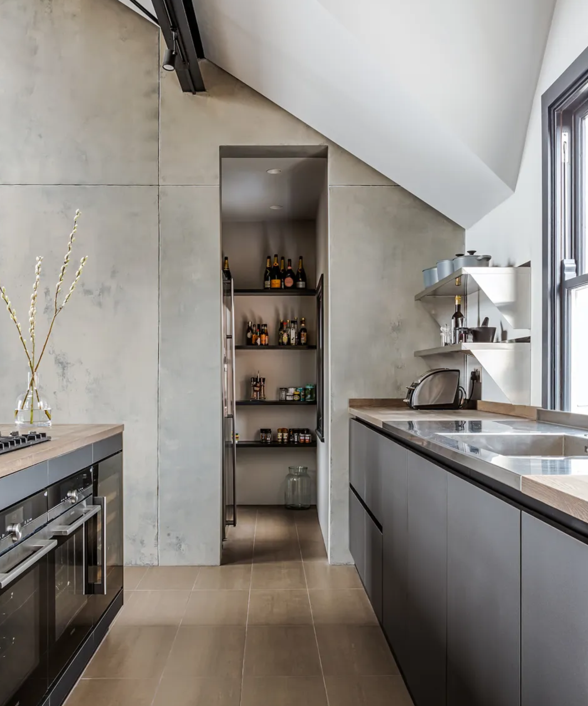 A hidden pantry within a contemporary kitchen