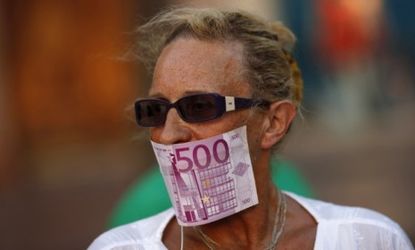 A woman protests Spain's bailout