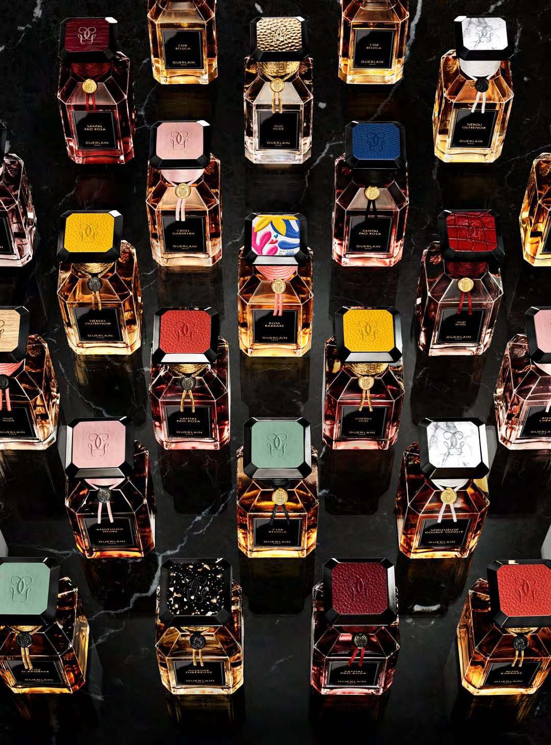 Guerlain fragrances lined-up with multi-coloured tops