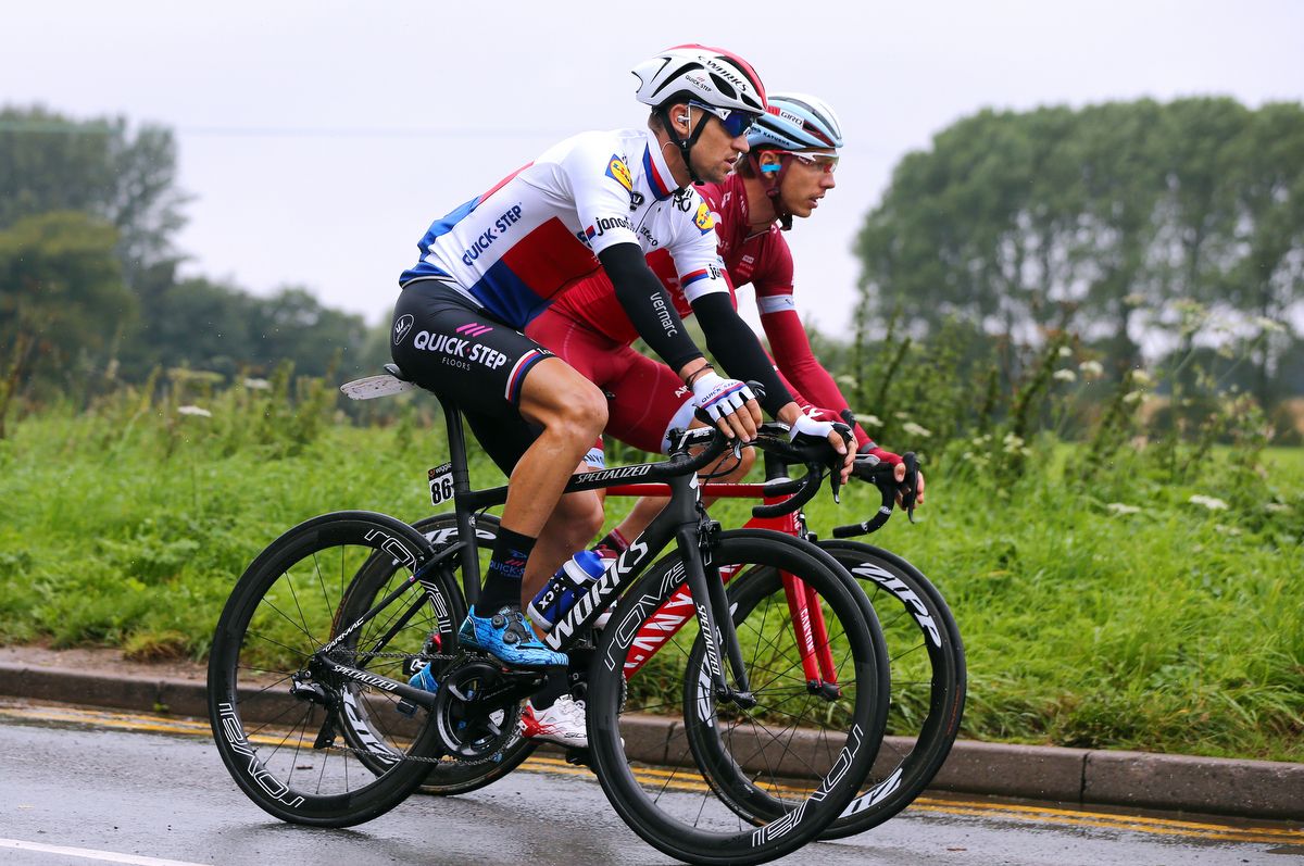 Former teammates Zdenek Stybar and Tony Martin chat in the bunch